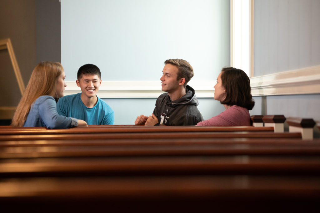 Students in pews - religion in New England